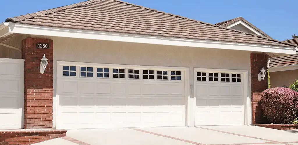 Residential garage door repair service for a double garage door in Colorado Springs, CO