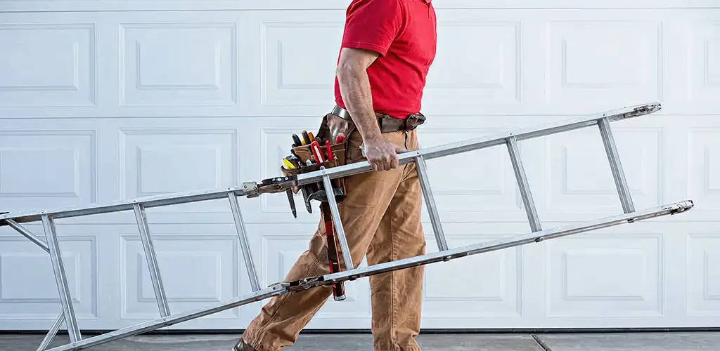 Garage door repair technician arriving with tools and ladder in Colorado Springs, CO