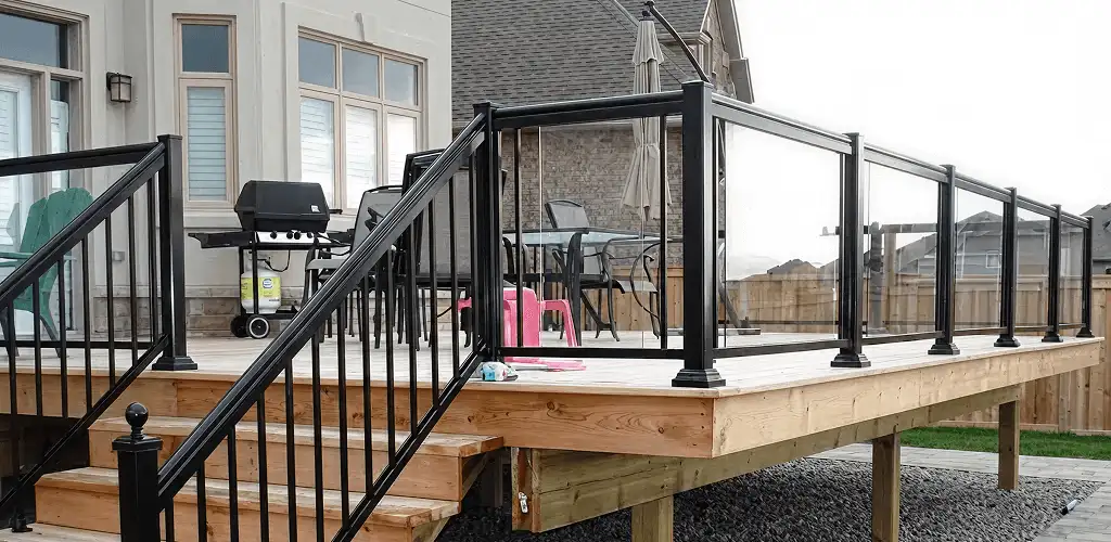 Handrail installation on a deck staircase for safety and code compliance in Colorado Springs, CO