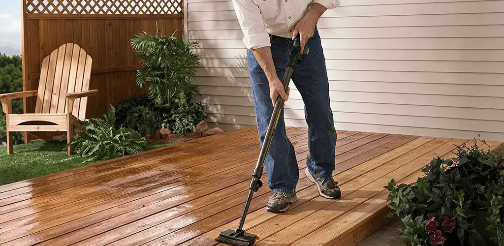 Deck staining service applying stain to a backyard wood deck in Colorado Springs, CO